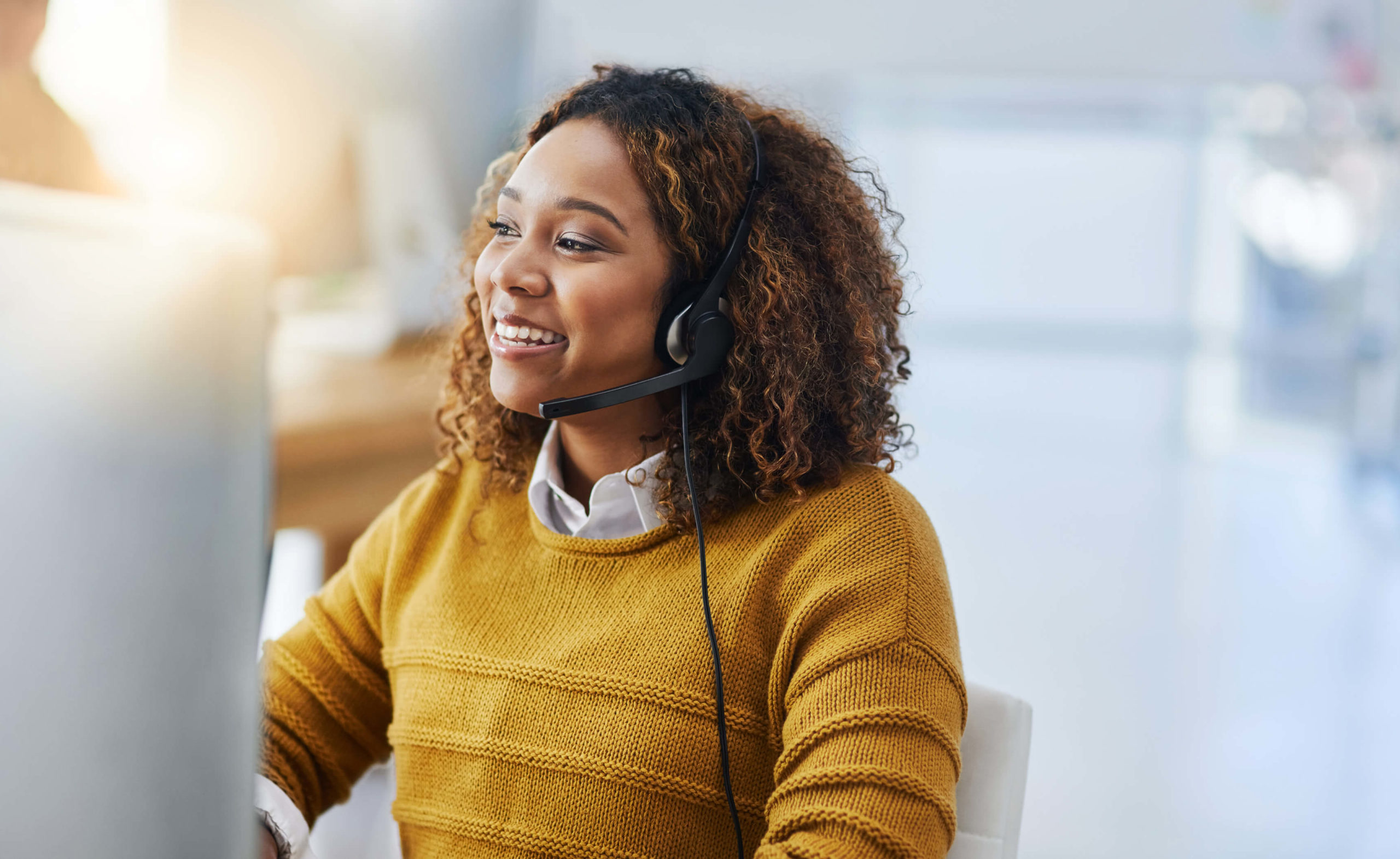 woman speaking through a headset device