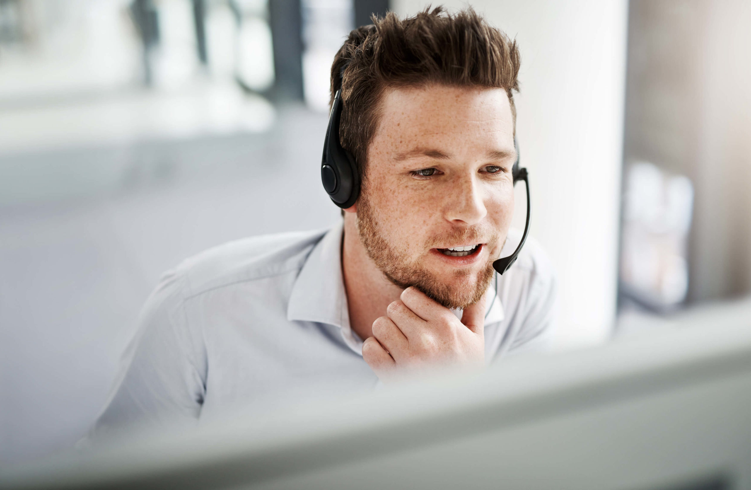 man speaking through a headset device