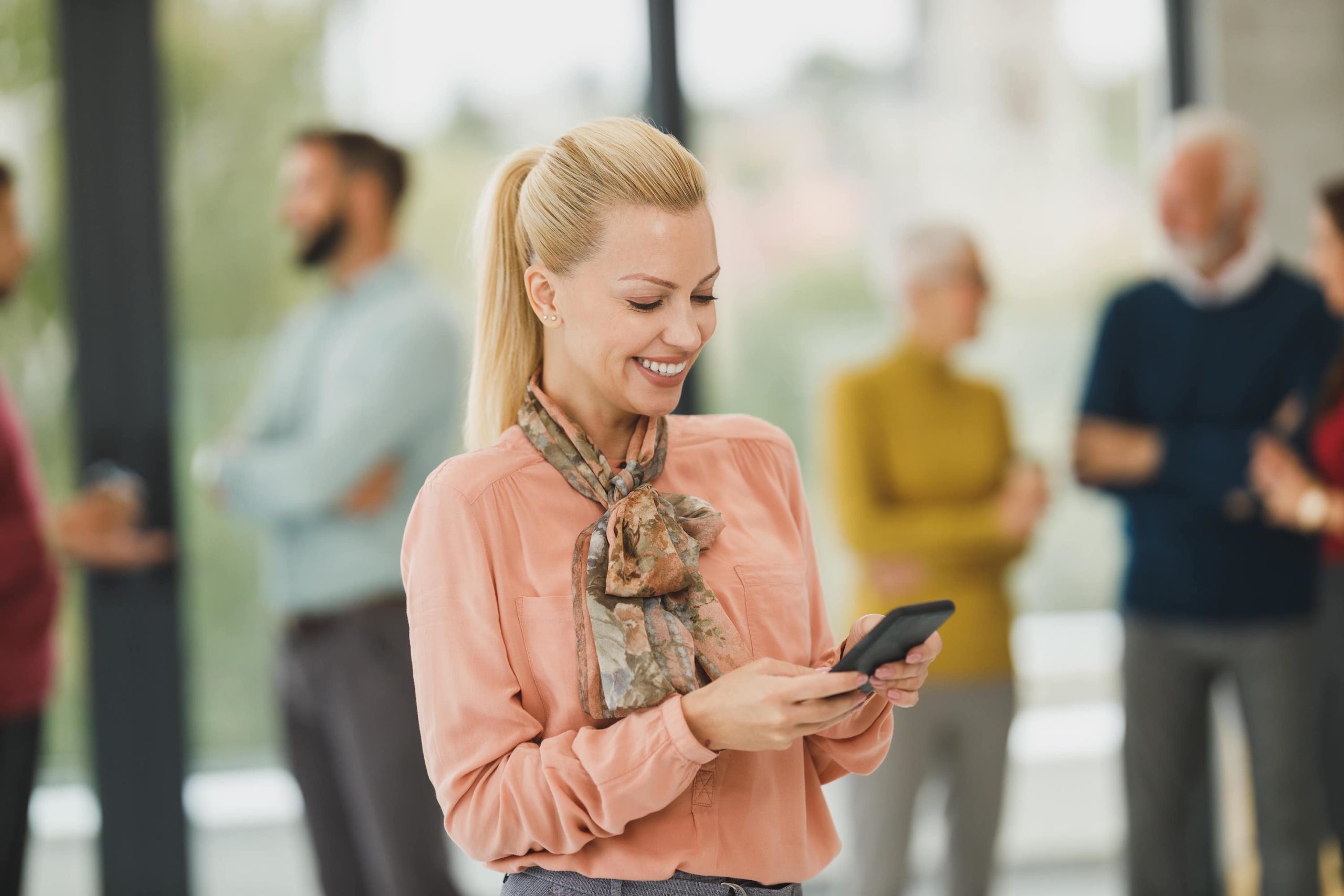 Woman Smiling At Phone