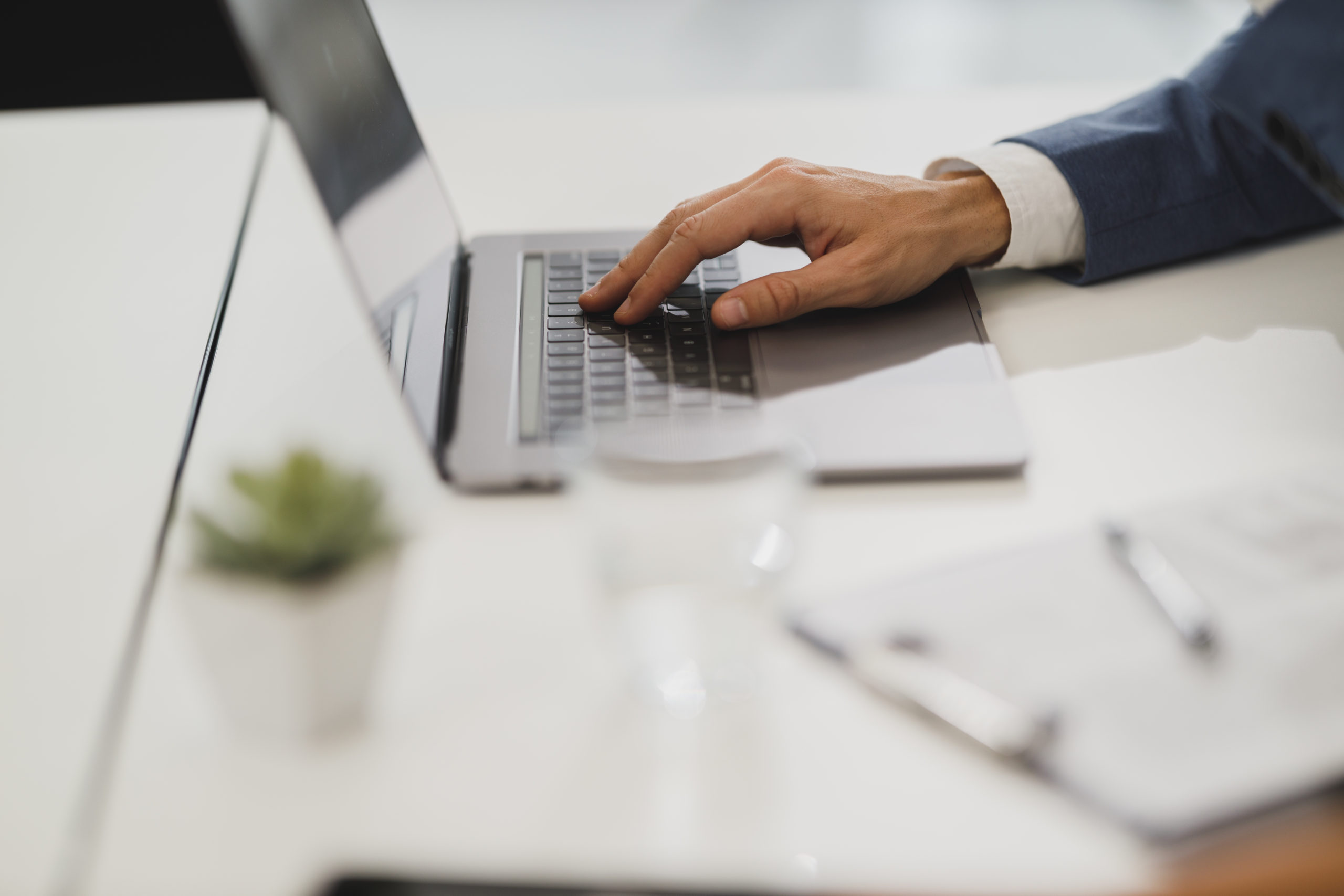 Man Typing On Keyboard In A Business Room