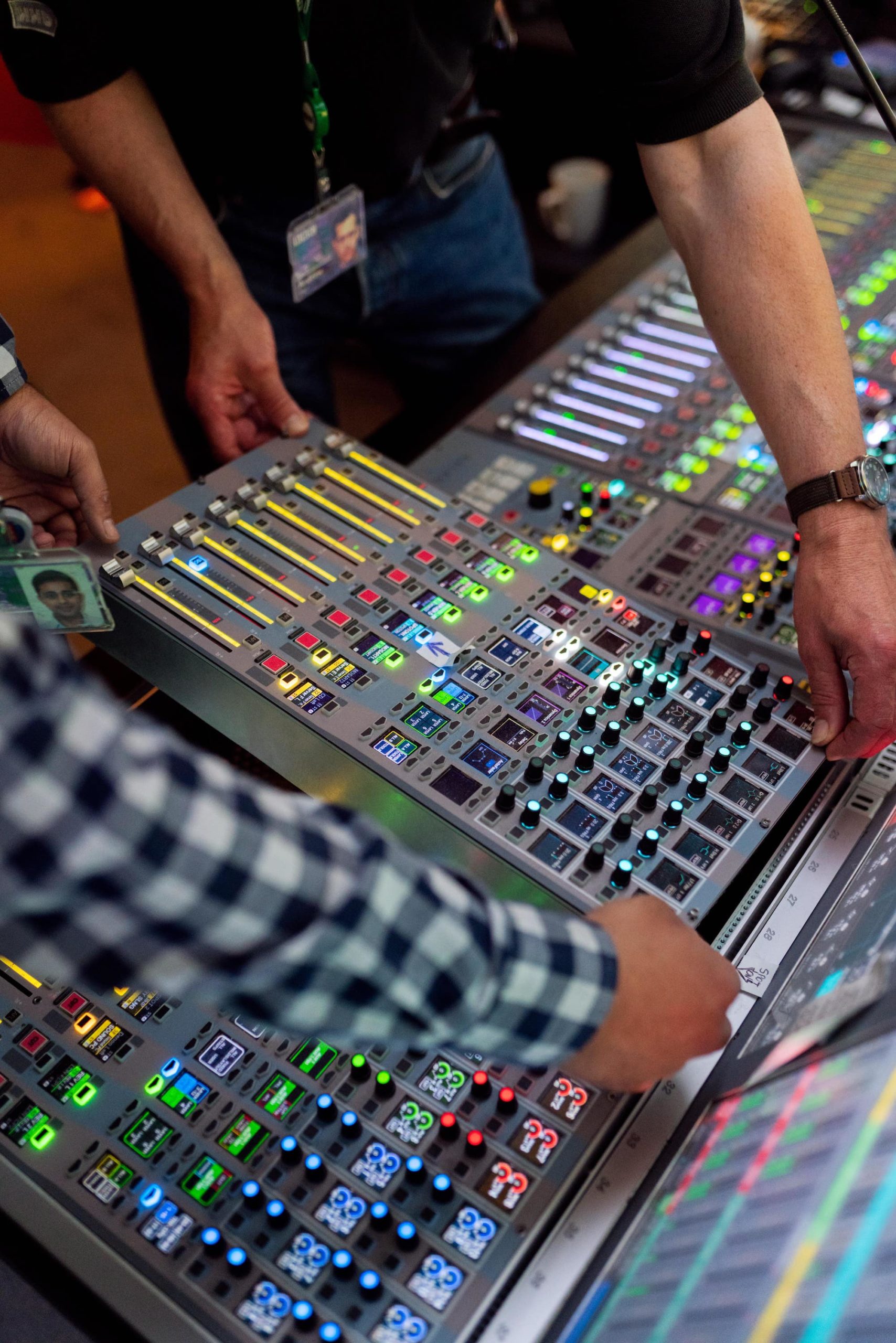 men working on a sound board