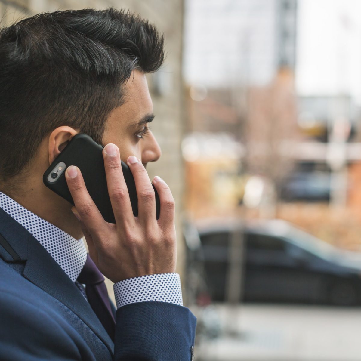 Man outside on mobile phone